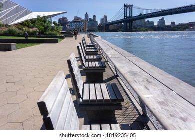 New York, NY / USA - September 19 2020: Pier 35 At East River Waterfront. Empty Wooden Benches Along Pier On Lower East Side, NYC