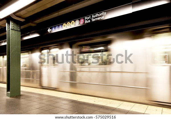 New York, NY, USA - September 6, 2016: Subway runs\
at Times Square–42nd Street/Port Authority Bus Terminal. The NYC\
Subway is one of the oldest and most extensive public\
transportations in the\
world.