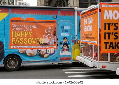 New York NY USA_March 24, 2021 Members Of The Lubavitcher Community Take A Break From Their Passover Parade Of Mitzvah Tanks In Chelsea In New York