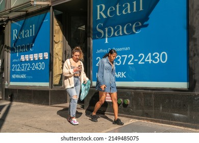 New York NY USA-April 22, 2022 Shoppers Pass Vacant Storefront In Soho In New York