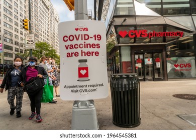 New York NY USA-April 28, 2021 A sign in front of a CVS Health drugstore in New York advertises the availability of the COVID-19 vaccine