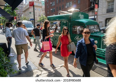 New York NY USA-August 31, 2019 Visitors Enjoy Free Ralphs Soft Serve Cold Brew Ice Cream From The Ralphs Coffee Truck Parked In Front Of The Ralph Lauren Store On Madison Avenue In New York