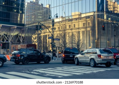 New York NY USA-February 18, 2022 The Moynihan Train Hall At Penn Station In New York Reflected In The Glass Of One Manhattan West. Traffic Is Backed Up As Drivers Attempt To Enter The Lincoln Tunnel