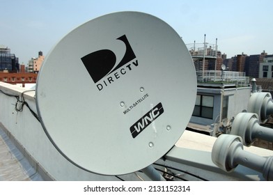 New York NY USA-June 1, 2007 A DirecTV satellite dish on a rooftop in NYC