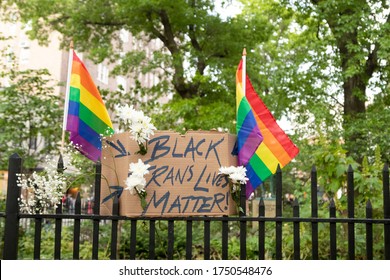 New York, NY USA-June 2, 2020 A Sign Stating Black Trans Lives Matter With Two Pride Flags In Greenwich Village During A Protest 