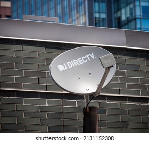 New York NY USA-June 21, 2017 A DirecTV satellite dish on the rooftop of a building in New York