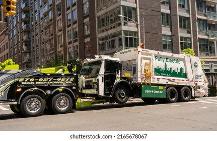 New York NY USA-June 8, 2022 A New York City Dept. Of Sanitation Electric Garbage Truck Is Towed In Chelsea In New York