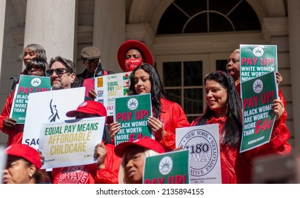 New York NY USA-March 15, 2022 Activists, community leaders, union members and politicians gather on the steps of City Hall in New York to rally against pay disparity on Equal Pay Day. 