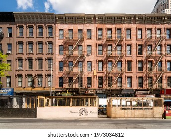 New York NY USA-May 12, 2021 Apartment Buildings With Restaurants Outdoor Dining On Ninth Avenue In The Hells Kitchen Neighborhood Of New York