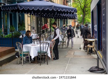 New York NY USA-May 8, 2021 Al Fresco Dining In The Soho Neighborhood Of New York