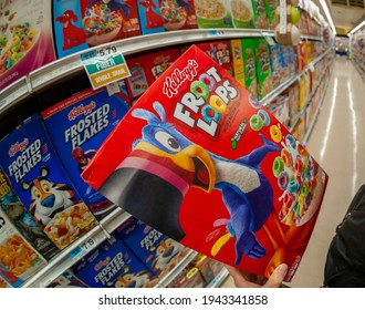 New York NY USA-October 30, 2018 A Shopper Chooses A Box Of Kellogg's Froot Loops Cereal A Supermarket In New York