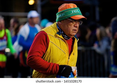 NEW YORK, NY--NOVEMBER 2, 2014: An Elderly Runner Competing In The 2014 New York City Marathon, Entering Mile 21 Of The Race.