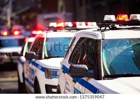 New York NYPD Police car with sirens at day on street