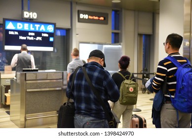 New York, NY/United States- 04/23/2019: Passengers Wait To Board A Delta Plane At Their Gate At JFK International Airport