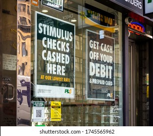 New York NY/USA_May 29, 2020 A check cashing business advertises that they cash stimulus checks