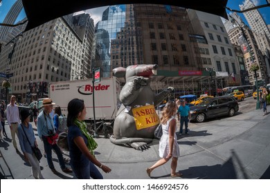 New York NY/USA-August 27, 2015 Workers outside an office building with their famous inflatable Scabby the Rat protest the use of non-union workers in an asbestos abatement project
