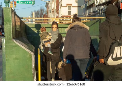 New York NY/USA-December 23, 2018 Residents And Visitors Enter And Leave The Bedford Avenue Station On The 