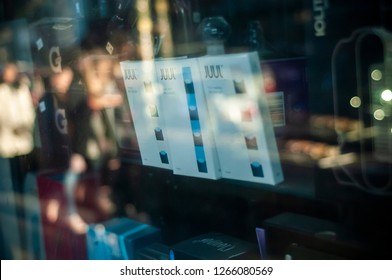 New York NY/USA-December 23, 2018 A Selection Of The Popular Juul Brand Flavored Vaping Supplies On Display In The Window Of A Vaping Store In New York