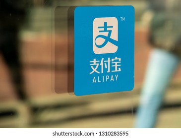 New York NY/USA-February 9, 2019 A sign on the entrance to a store in New York informs Chinese shoppers that the establishment accepts payment via Alipay