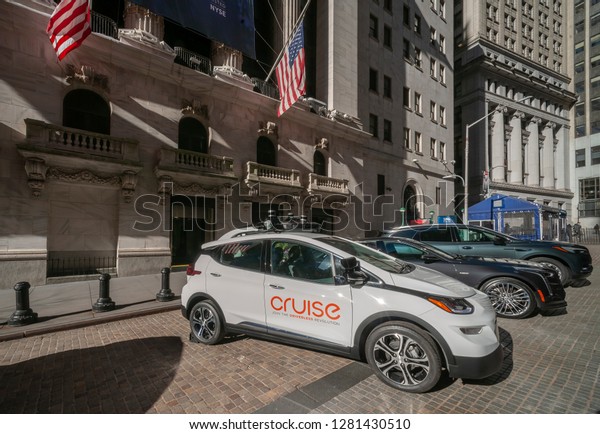 New York NY/USA-January 11, 2019 An example of a\
autonomous driven vehicle outside the New York Stock Exchange in\
Lower Manhattan decorated promoting the innovations of the General\
Motors Company