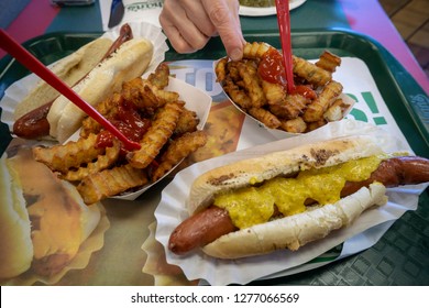 New York NY/USA-January 6, 2019 An order of hot dogs and fries in the stand-alone Nathan's Famous location in the Bay Ridge neighborhood of Brooklyn in New York on its last day