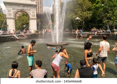 New York NY/USA-July 20, 2019 New Yorkers and visitors frolic by the fountain in Washington Square Park in Greenwich Village in New York