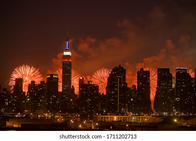 New York NY/USA-July 4, 2010. The Manhattan Skyline And The Macy's Fourth Of July Fireworks Display In The Hudson River Behind It.