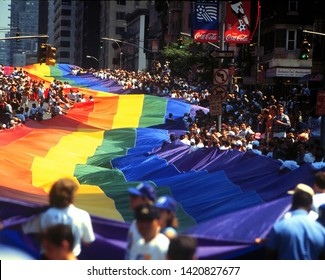 New York NY/USA-June 26, 1994 Giant One Mile Long Rainbow Flag Is Unfurled On First Ave. In New York City During The Celebration And Gay Pride Day/Stonewall 25 Parade