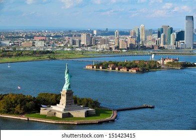 NEW YORK - OCT 15 2009: Aerial view of the Statue of Liberty and Ellis Island. From 1892 to 1954, over 12 million immigrants entered USA through the portal of Ellis Island in New York Harbor