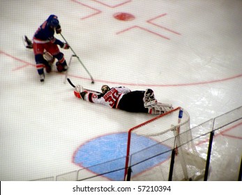 NEW YORK - OCTOBER 2: Devils Goalie Martin Brodeur Dives And Stretches To Make A Save Against The Rangers In A Preseason Game At Madison Square Garden October 2, 2005 In New York, NY.