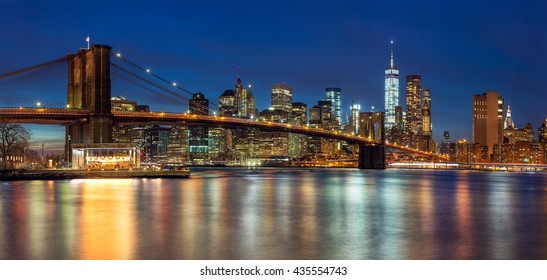 New York - Panoramic view of Manhattan Skyline with skyscrapers  and famous Brooklyn Bridge by night, big size 