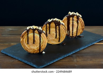 New York roll, round croissant filled and covered with chocolate.  - Shutterstock ID 2249684689