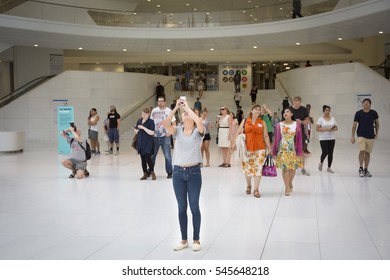 NEW YORK - SEPT 11 2016: People Take Pictures Of The Freedom Tower From The Main Concourse Of The Oculus, The New World Trade Center Transit Hub On The 15th Anniversary Of The 911 Terror Attack.