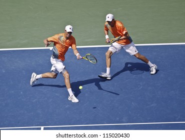 NEW YORK - SEPTEMBER 07: Bob & Mike Bryan of USA play ball during men double final against Leander Paes of India & Radek Stepanek of Czech Republic at US Open tennis tournament on Sep 7, 2012 in NYC