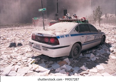 NEW YORK - SEPTEMBER 11: Ash covers a NYPD vehicle as it lies near the area known as Ground Zero after the collapse of the Twin Towers on September 11, 2001 in New York City.