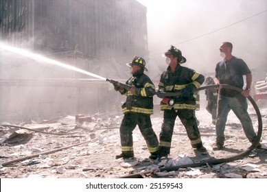 NEW YORK - SEPTEMBER 11:  New York City firefighters work near the area known as Ground Zero after the collapse of the Twin Towers September 11, 2001 in New York City.