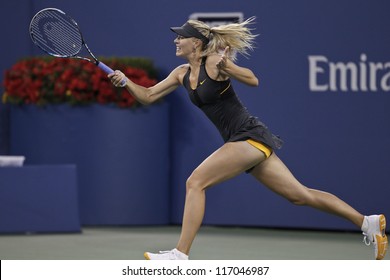 NEW YORK - SEPTEMBER 2: Maria Sharapova of Russia returns ball during 4th round match against Nadia Petrova of Russia at US Open tennis tournament on September 2, 2012 in Flushing Meadows New York