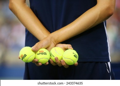 NEW YORK - SEPTEMBER 4, 2104: Ball boy holding tennis balls at the Billie Jean King National Tennis Center during US Open 2014