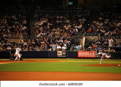 NEW YORK - SEPTEMBER 7: Orioles Pitcher Jake Arrieta Delivers To Yankees Catcher Jorge Posada In A Game At Yankee Stadium September 7, 2010 In New York, NY