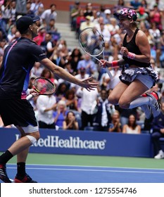 NEW YORK - SEPTEMBER 8, 2018: 2018 US Open mixed doubles champions Bethanie Mattek-Sands of USA and Jamie Murray of Great Britain celebrate victory after final match at National Tennis Center in NY