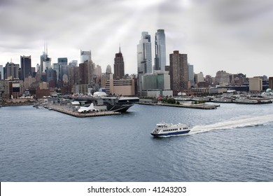  New York skyline and sea, air, space museum with an aircraft carrier along the shore of the Hudson river under dark grey skies