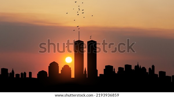 New York skyline silhouette with Twin\
Towers and birds flying up like souls at sunset. 09.11.2001\
American Patriot Day banner. NYC World Trade\
Center.