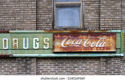 New York State, USA - November 14, 2021:  Rusty Old Fashioned Drugstore Sign With Coca Cola Logo