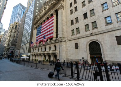 New York Stock Exchange After The Coronavirus Outbreak With Woman In Mask Walking By At 11 Wall Street, New York, NY, USA On March 21, 2020