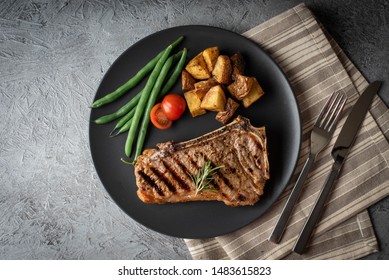 New York Strip Steak On Concrete Background