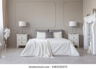 New York Style Bedroom Interior With Symmetric Design, Copy Space On Empty Grey Wall