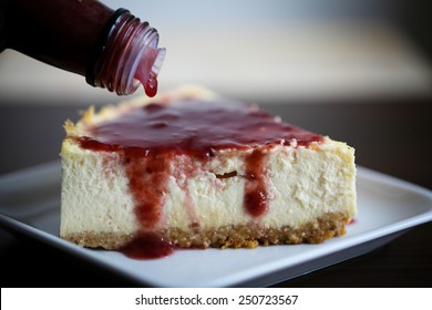 New York Style Cheesecake Slice With Raspberry Syrup