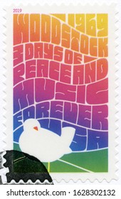 NEW YORK, UNITED STATES OF AMERICA - AUGUST 08, 2019: A stamp printed in USA shows Woodstock 3 days of peace and music. 1969, Forever, 2019 