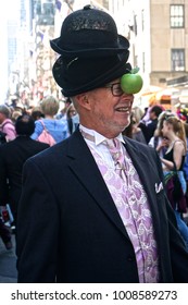 New York, New York / United States - April 16, 2017: Man Wearing Black Hats And A Green Apple In An Homage To The René Magritte Painting “The Son Of Man” At The Fifth Avenue Easter Parade.