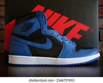 New York, United States - April 19, 2022: Nike Air Jordan 1 High, Marina Blue, Black Background